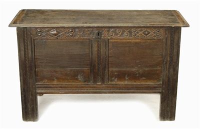 Appraisal: A joined oak chest the moulded edge hinged top above