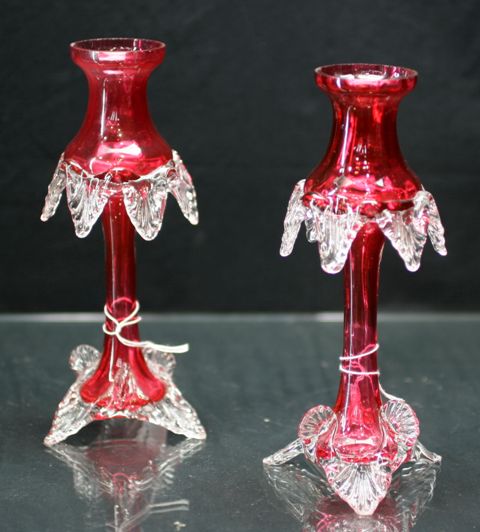 Appraisal: Pair of ruby glass candlesticks in clear glass foot and