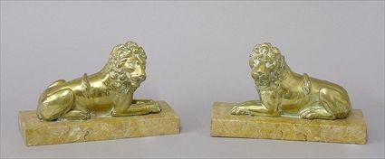 Appraisal: PAIR OF CONTINENTAL BRASS LION-FORM TABLE DECORATIONS ON MARBLE Each