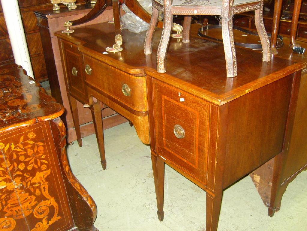 Appraisal: An Edwardian mahogany Sheraton revival breakfront sideboard fitted with a