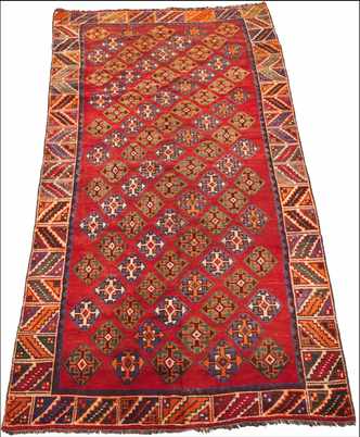 Appraisal: Kazak Carpet Colorful wool on wool weft geometric diamonds on