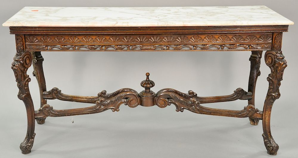 Appraisal: Carved hall table with faces and marble top ht in