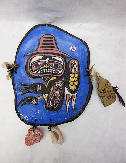 Appraisal: HAIDA INDIAN POTTERY FETISH WALL PLAQUE central figure with seashell