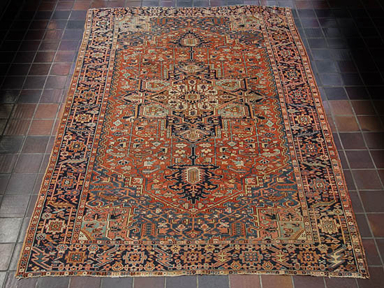 Appraisal: Heriz Rug Circa Red ground with herati field centering a