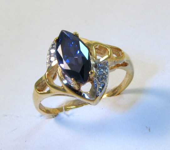 Appraisal: TANZANITE AND FOURTEEN KARAT GOLD RING with appraisal The ring