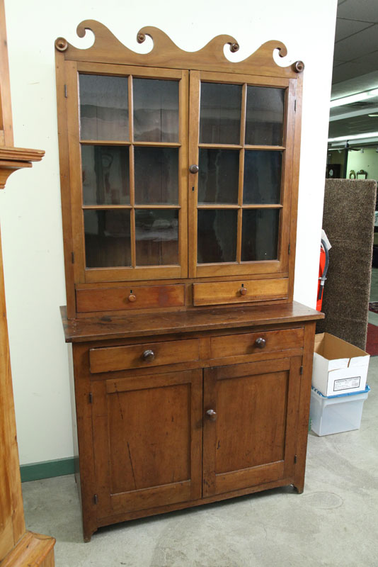 Appraisal: TWO PIECE STEPBACK CUPBOARD With a scrolled crest over two