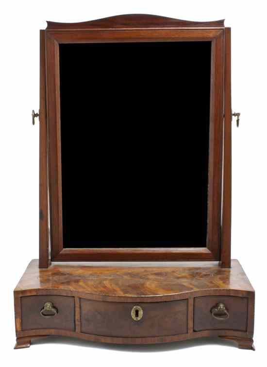 Appraisal: An American Mahogany Dressing Mirror having a shaped crest above