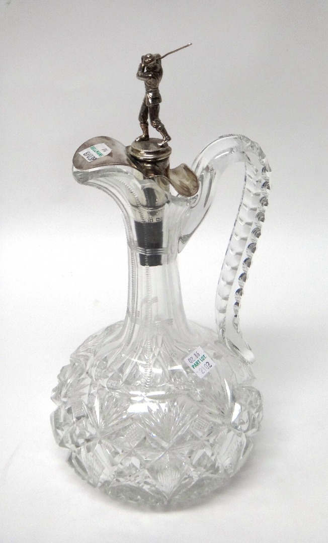 Appraisal: A facet cut glass claret jug with a silver mounted