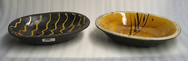 Appraisal: Two glazed pottery oval bowls Each of oval silhouette with