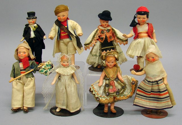 Appraisal: Lot of painted bisque dolls all representing foreign countries Arm