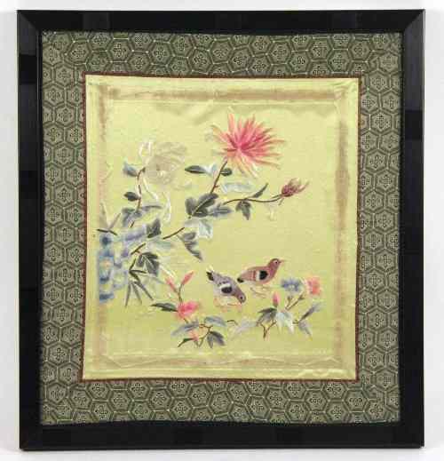 Appraisal: A Chinese embroidered silk picture of birds beneath flowering chrysanthemums