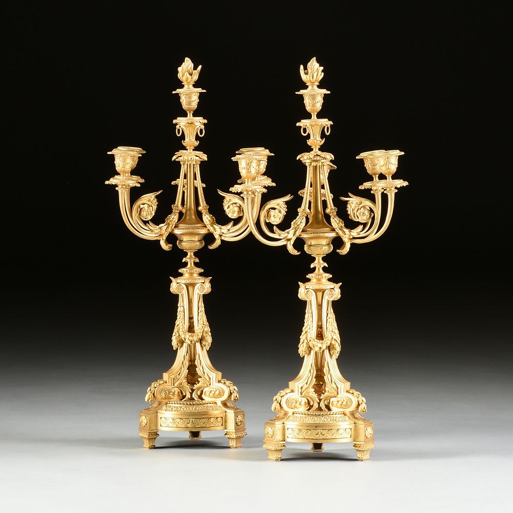 Appraisal: A PAIR OF LOUIS XVI STYLE ORMOLU FIVE-LIGHT CANDELABRA THIRD