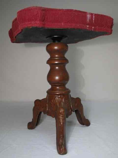 Appraisal: Victorian era adjustable height piano stool Measures '' wide at