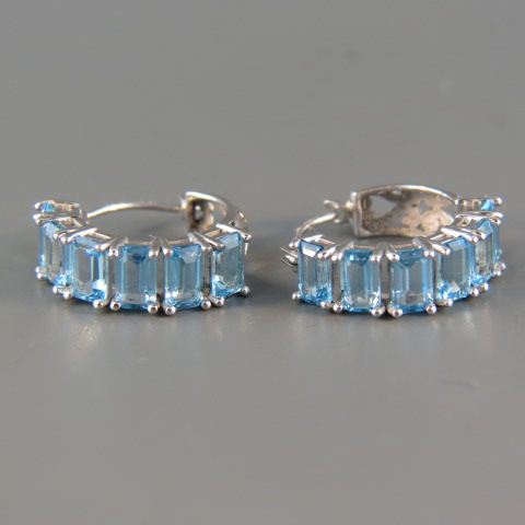 Appraisal: Blue Topaz Earrings each with rich blue emerald cut gems