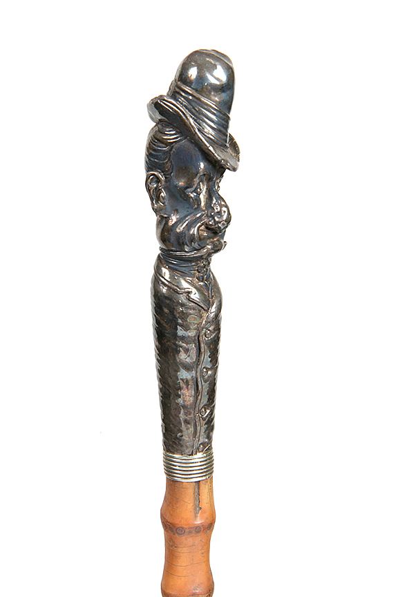 Appraisal: Character Portrait Cane Ca - A high relief carving of