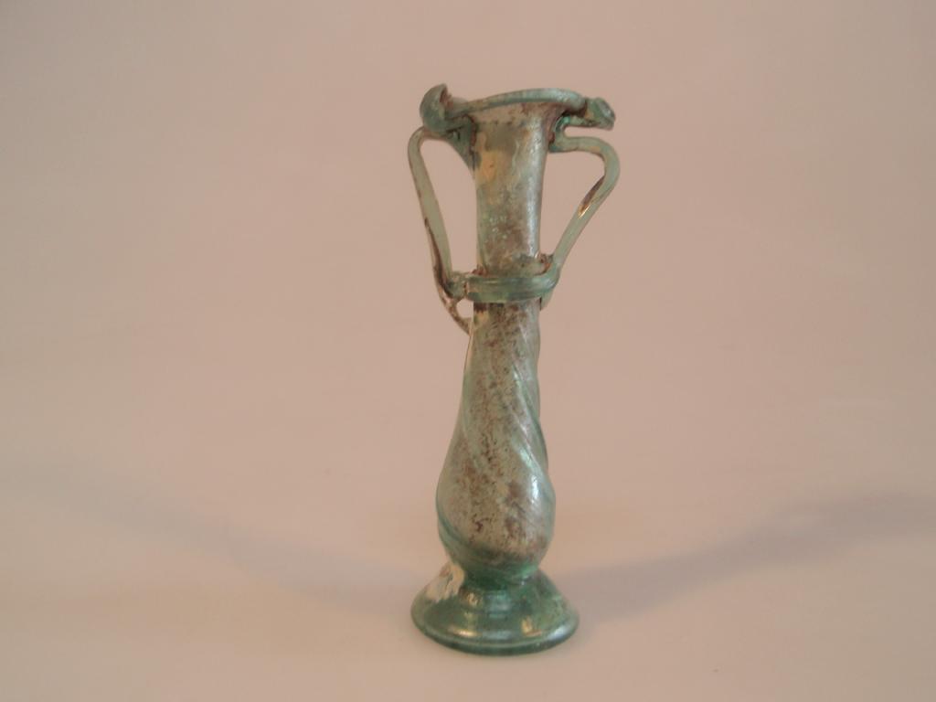 Appraisal: A Roman bluish-green footed glass kohl-tube the funnel mouth with