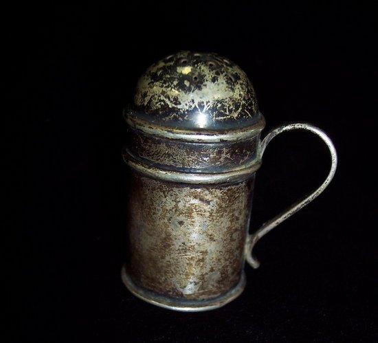 Appraisal: A small kitchen type pepper pot with C scroll handle