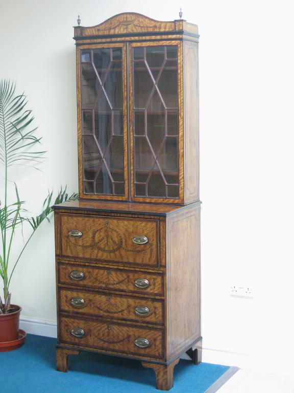 Appraisal: A Sheraton style satinwood Secretaire Bookcase with pair of astragal