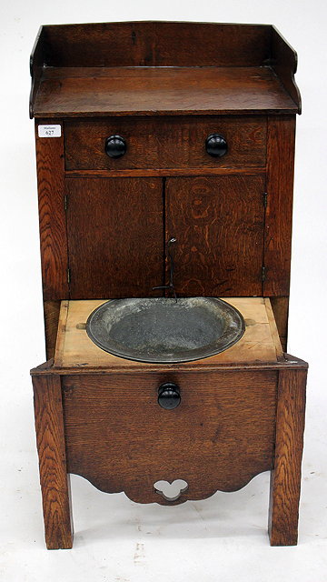 Appraisal: A TH CENTURY OAK NIGHT STAND with galleried top over