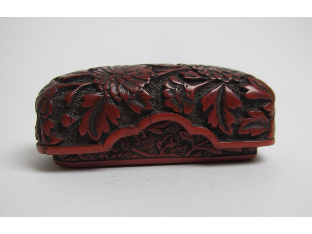 Appraisal: A Chinese finely carved cinnabar lacquer rectangular box the cover