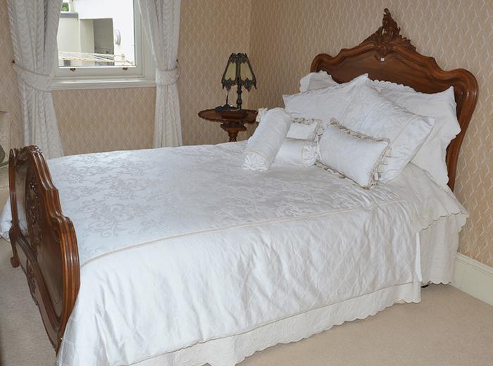 Appraisal: CLASSIC FRENCH DOUBLE BED WITH CUSHIONS AND BED LINEN X