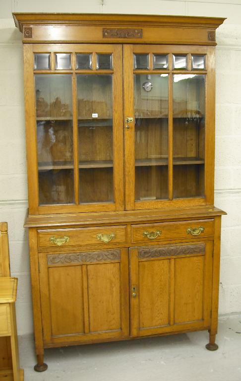 Appraisal: Edwardian oak Arts Crafts style bookcase cabinet the two glazed