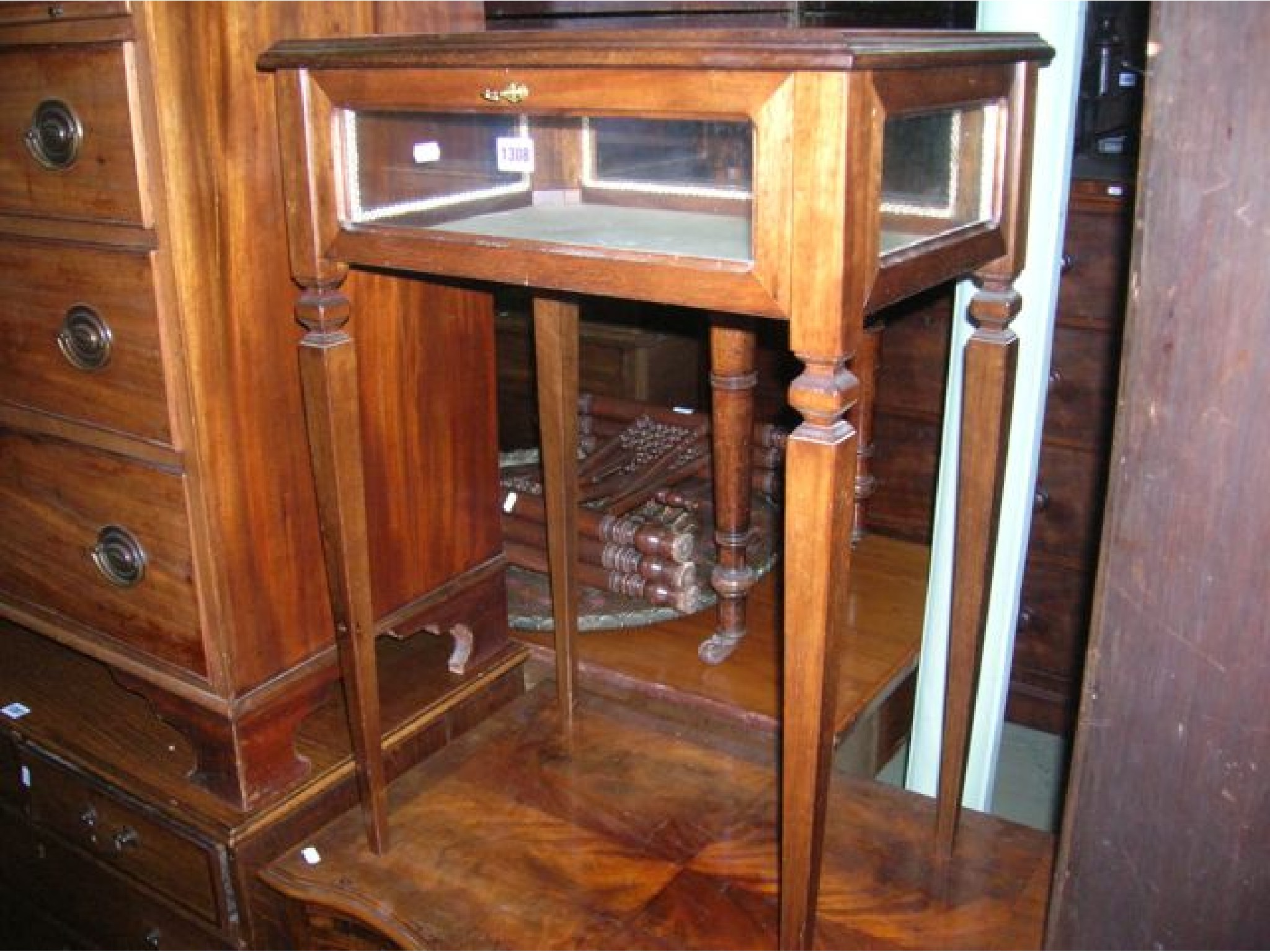 Appraisal: A small mahogany vitrine bijouterie table the shallow glazed display