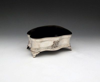 Appraisal: An Edwardian silver mounted and velvet dressing table box by