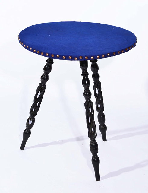 Appraisal: AN EBONISED OCCASIONAL TABLE with blue felt top and three