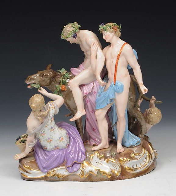 Appraisal: A MEISSEN PORCELAIN BACCHANALIAN GROUP on an oval rococo base