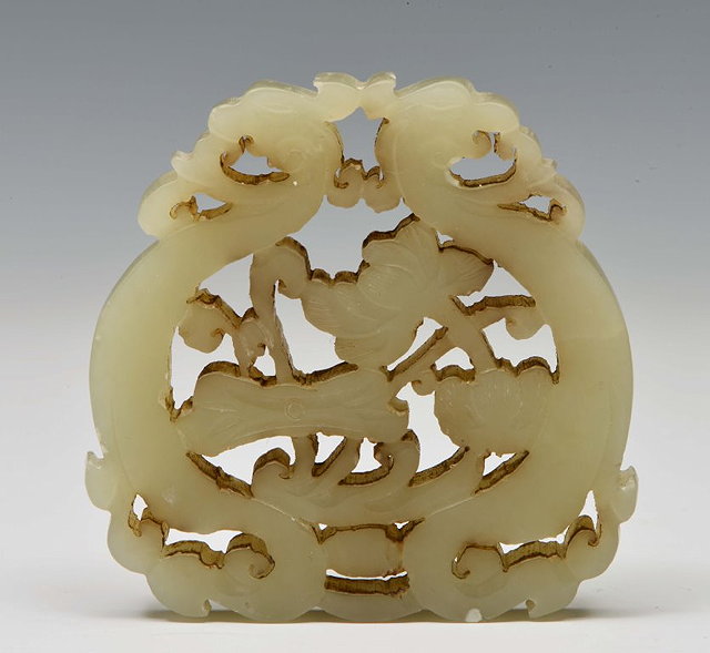 Appraisal: A CHINESE MUTTON FAT JADE PENDANT carved and pierced as