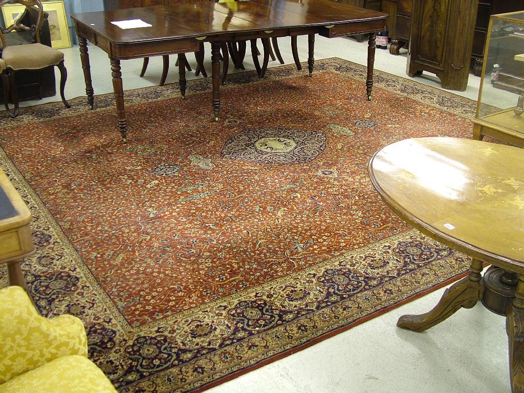 Appraisal: Persian style carpet with extensive foliate decorations and multiple borders