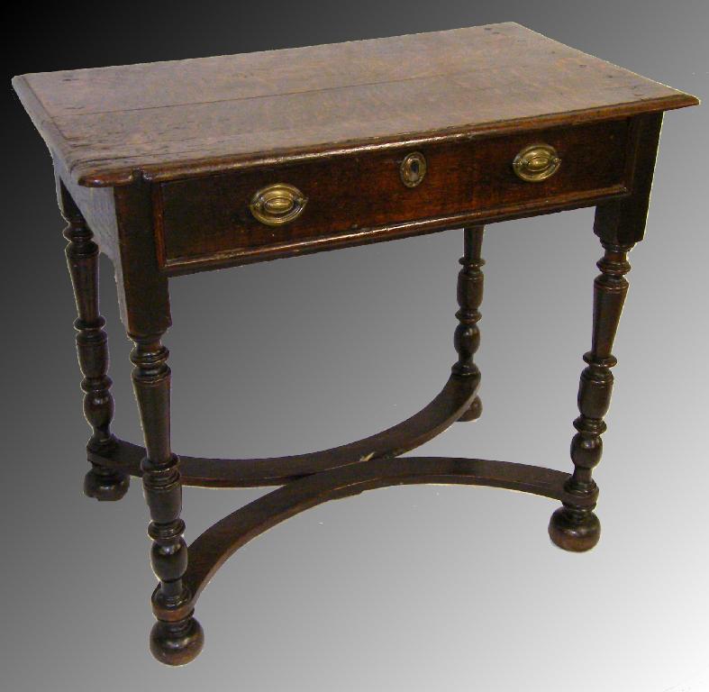 Appraisal: Antique oak side table the moulded top over a long