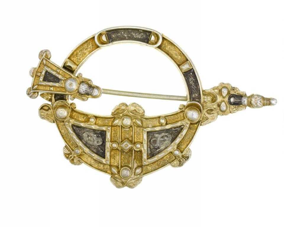 Appraisal: AN IRISH CELTIC REVIVAL PARCEL GILT SILVER ANNULAR BROOCH BY