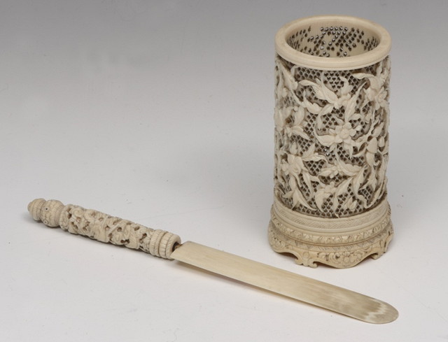 Appraisal: A CHINESE CARVED IVORY CYLINDRICAL VASE with finely pierced foliate