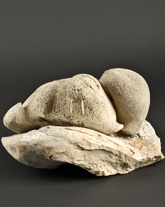 Appraisal: An Inuit Whalebone Sculpture of Two Walrus each with ivory