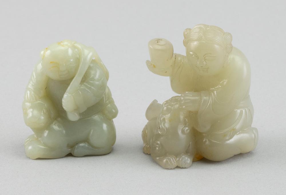 Appraisal: TWO CHINESE CARVED CELADON JADE FIGURE GROUPS HEIGHTS TWO CHINESE