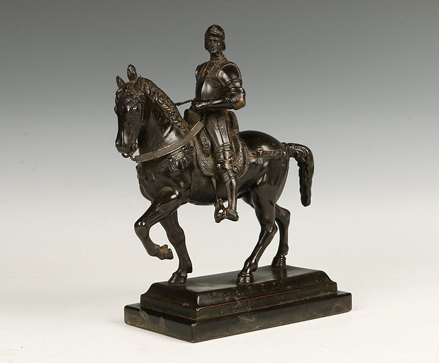 Appraisal: A GRAND TOUR BRONZE PATINATED METAL FIGURE wearing a suit