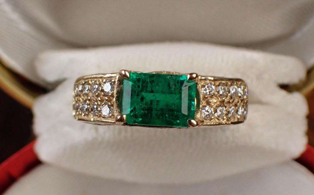 Appraisal: EMERALD DIAMOND AND FOURTEEN KARAT GOLD RING The k yellow