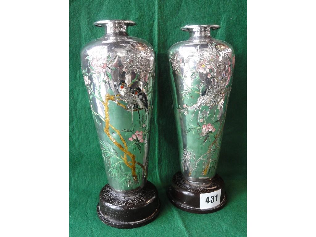 Appraisal: A pair of Chinese silver vases with engraved and enamelled