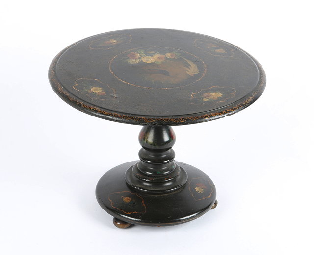 Appraisal: AN EARLY VICTORIAN BLACK LACQUERED TILT TOP MINIATURE CIRCULAR TABLE