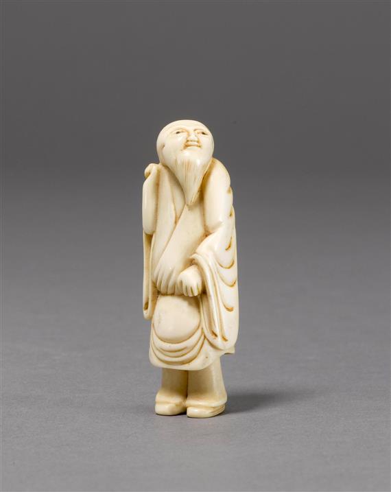 Appraisal: NETSUKE OF A STANDING MALE FIGURE Japan th c H