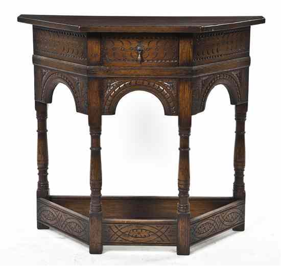 Appraisal: A Renaissance Revival Console Table having a trapezoidal top over