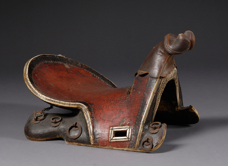 Appraisal: Saddle India th century wood frame covered in painted leather