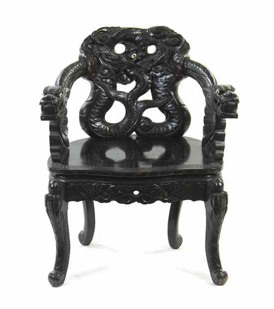 Appraisal: A Chinese Carved Armchair heavily carved with a writhing dragon