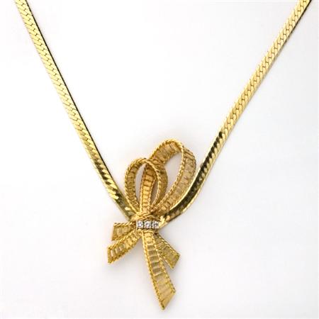 Appraisal: Gold and Diamond Bow Chain Necklace Estimate -