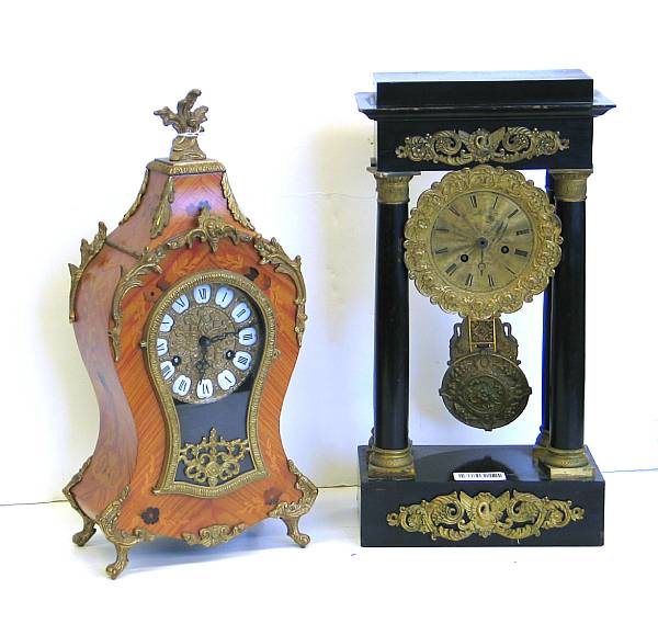 Appraisal: A Empire gilt bronze mounted ebonized wood portico clock and