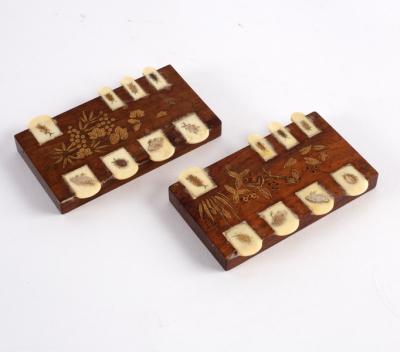 Appraisal: A pair of Japanese rosewood bezique markers with gilded decoration