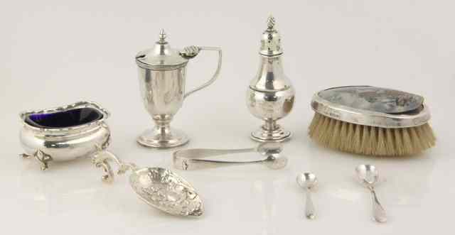 Appraisal: A vase shaped silver pepper pot Birmingham an oval mustard