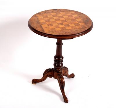 Appraisal: A Victorian walnut tripod games table circa the circular top